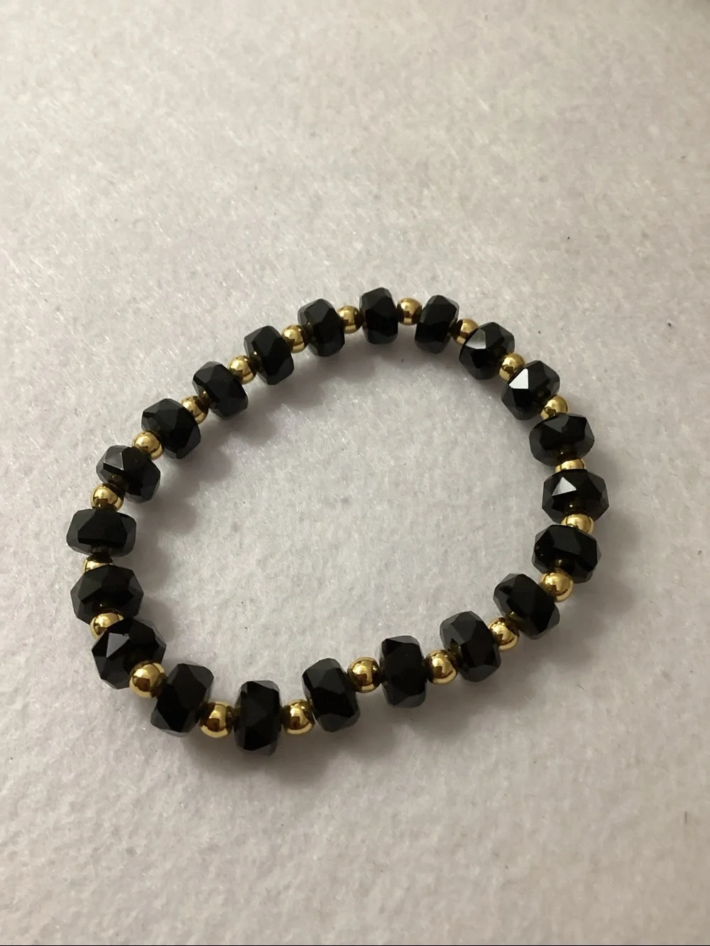 Macy’s Black Crystal and 14K Gold Plated Ball Stretch Bracelet